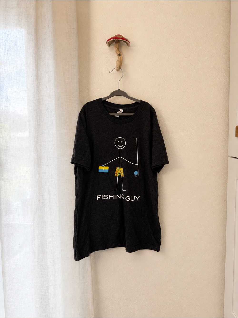 Bella Canvas Black 'Fishing Guy' Tee with Yellow & Blue Graphic